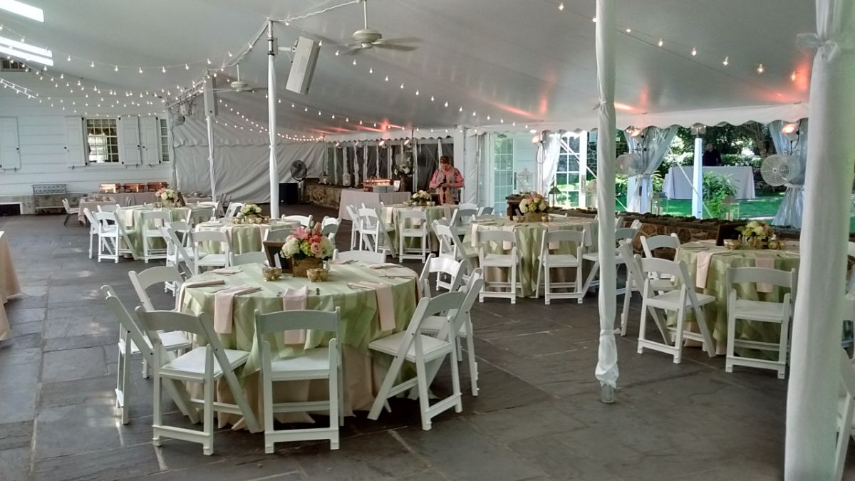 tables decorated with center pieces for a special event