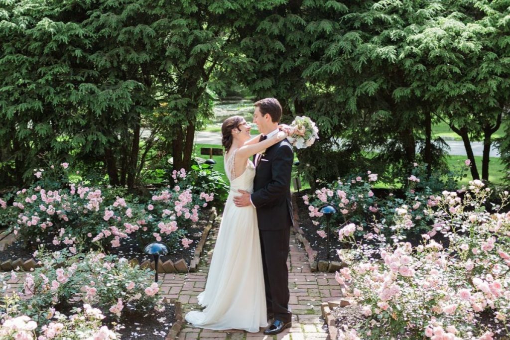 happy newly married couple smiling at each other